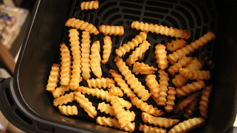 A serving of crinkle French fries in the Cosori TurboBlaze basket.