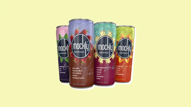 Four Mockly cans on a yellow background