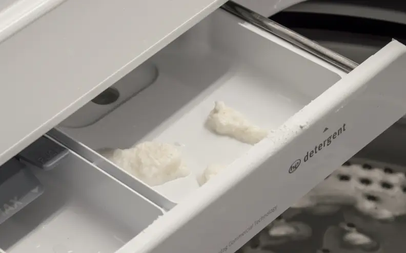 Don't use powdered detergent, or you'll get residue in the drawer.