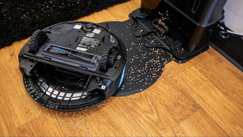 The floor covered in cork from a robot vacuum mishap.