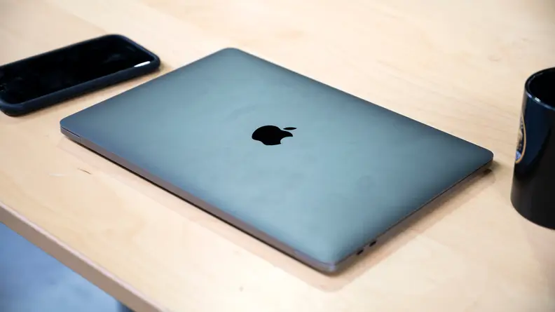 A medium shot of a closed Macbook Pro, showing off the matte Space Grey aluminum case.