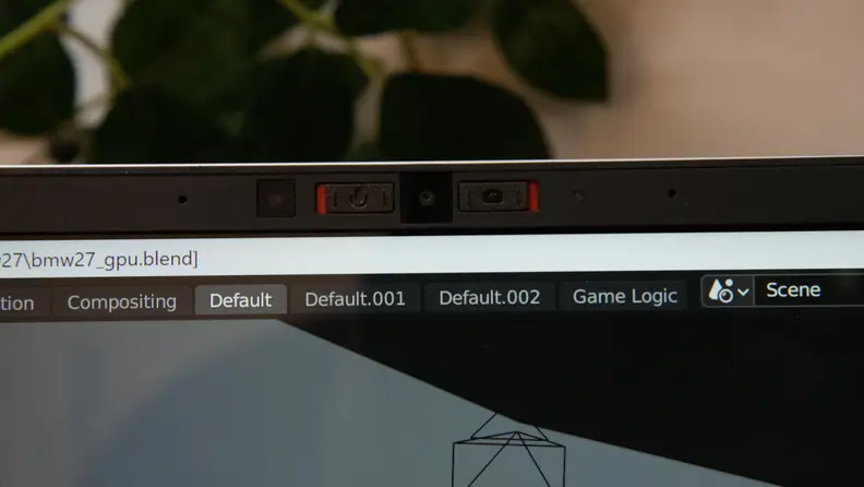 A closeup of the webcam and microphone on the laptop's bezel