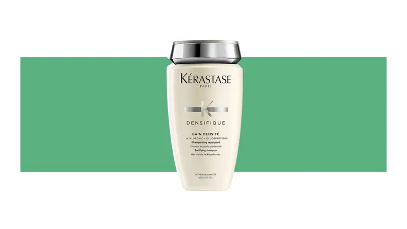 Kerastase hair product on a green background.