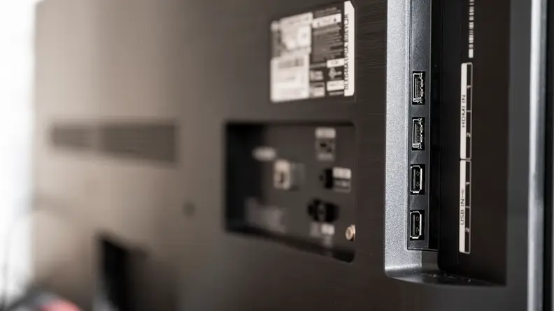 A close-up of the connectivity inputs on the back of the LG A1's panel