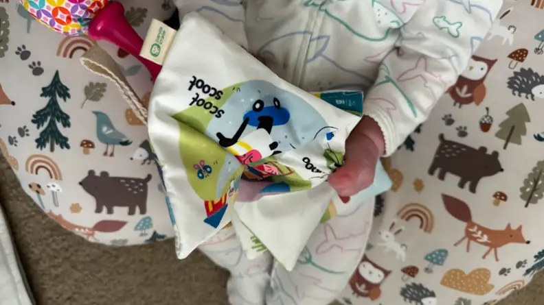 Baby with crinkle book.