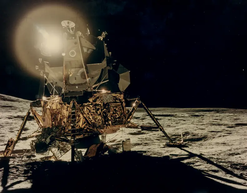 Reflections of the Sun over the LM “Antares” in the lunar black sky.