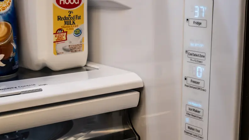 On the right wall of the inside of the Samsung RF28R6201SR refrigerator, we can see a control panel.