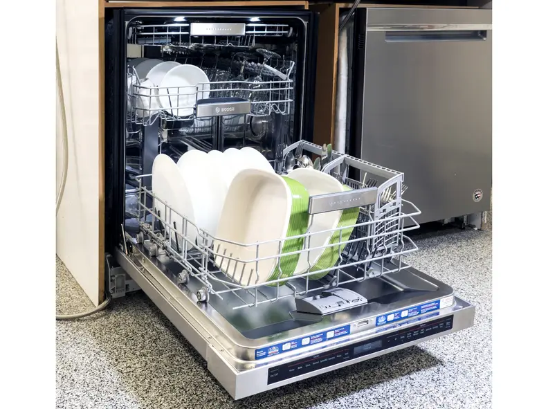 The dishwasher's interior is spacious and brightly lit