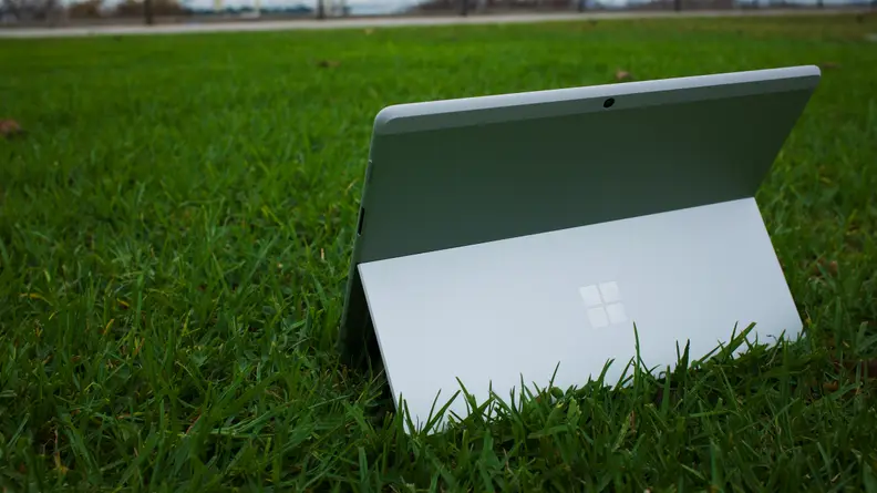 A view of the backside of the Surface Pro X, showcasing the kickstand when active.