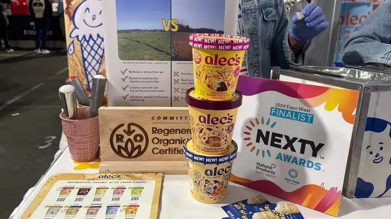 Stacks of ice cream pints in front of a display