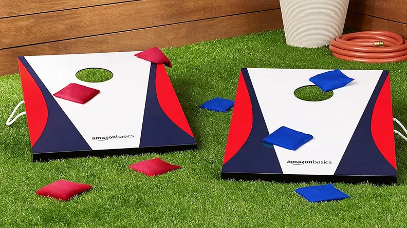Close up of a cornhole game outside.