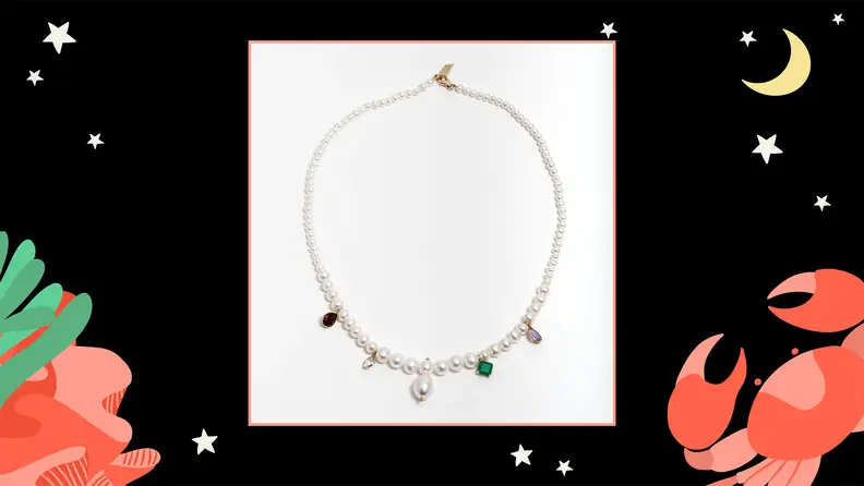 A pearl necklace with gemstone pendants.