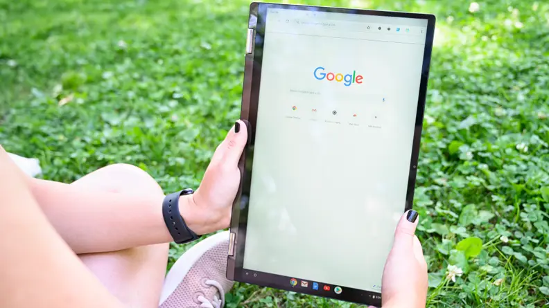 The Asus Chromebook C434TA held like a tablet