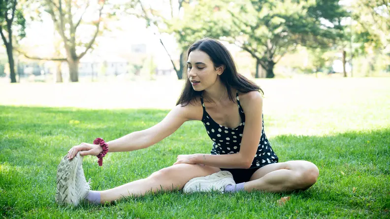 woman stretching in outdoor voices exercise dress