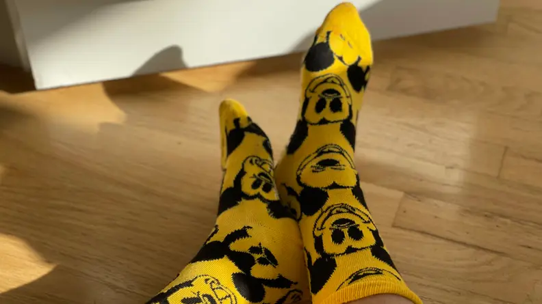 Mickie socks on wood floor