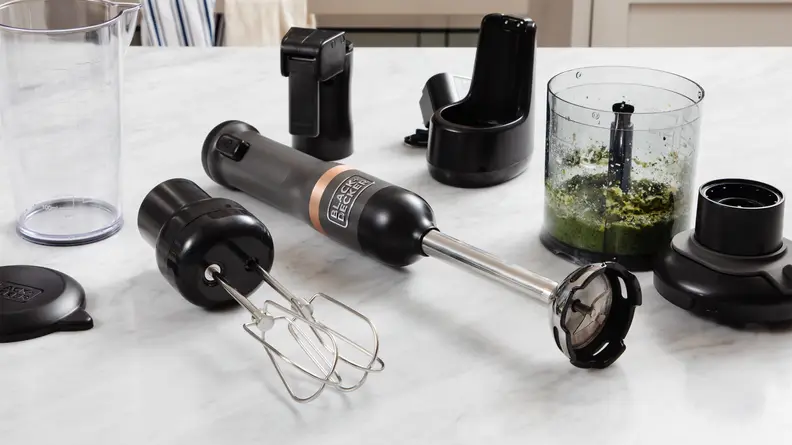 The Black & Decker Kitchen Wand in the color black next to accessories and blender.