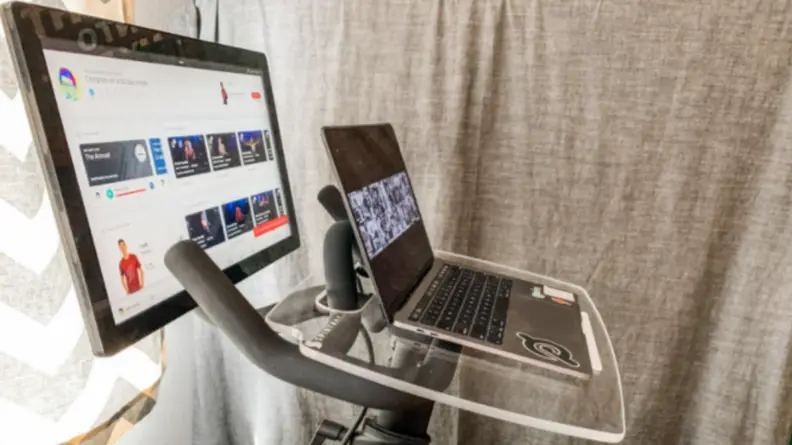 Spintray attached to a Peloton with a laptop on the tray
