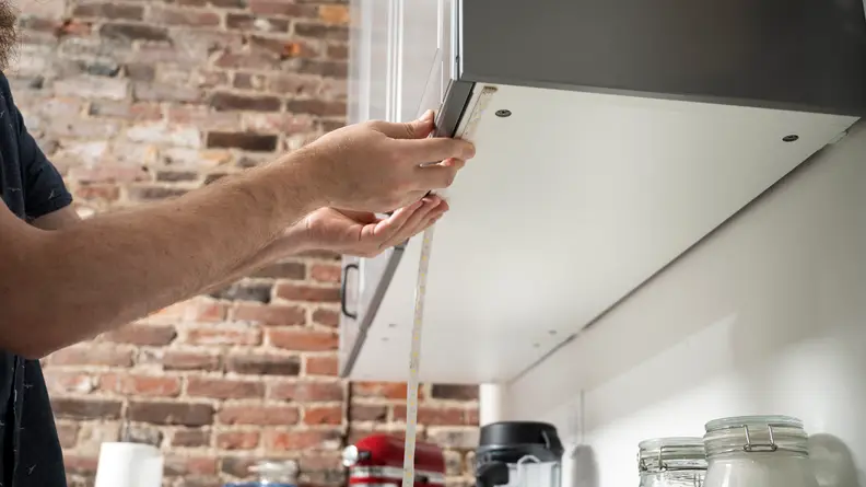 Installing strip lights under kitchen cabinet
