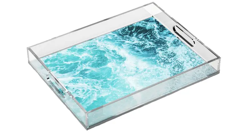 Acrylic tray with wave pattern.