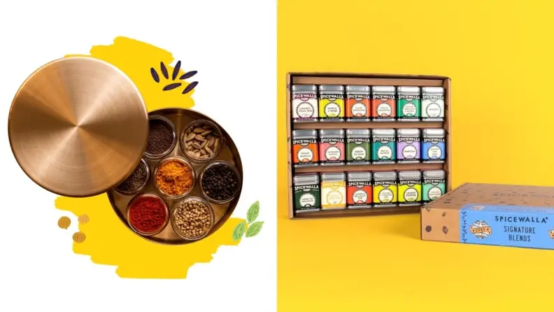 On left, a round metal tin with the lid removed, revealing 7 circular bowls of spices. On right, an open box of Spicewalla spice blends on a yellow background.