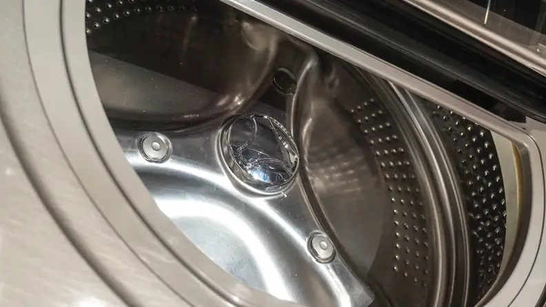 The stainless steel interior is designed to be gentle on clothing.