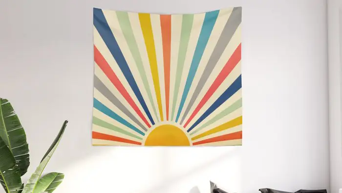 Tapestry with rainbow streaks coming from sun.