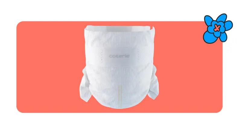 A single Coterie diaper in front of a red background with a blue cartoon flower in the corner.