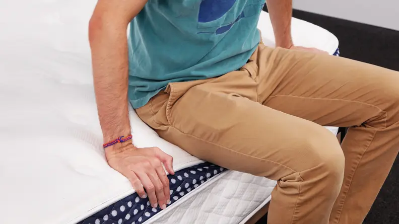 Man sitting on mattress