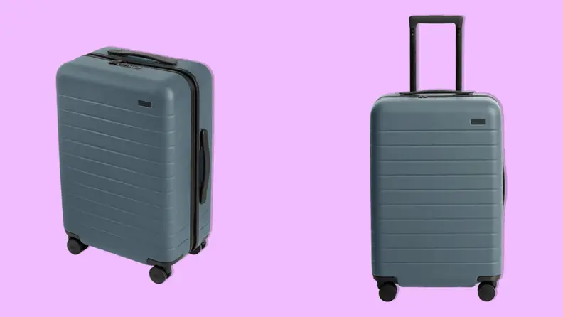 Front and side angles of the Away Travel The Bigger Carry-On in Coast Blue color on a magenta background