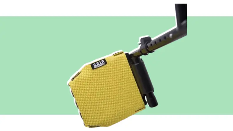 Yellow Grip Solutions Footplate Grip attached to wheelchair footplate.