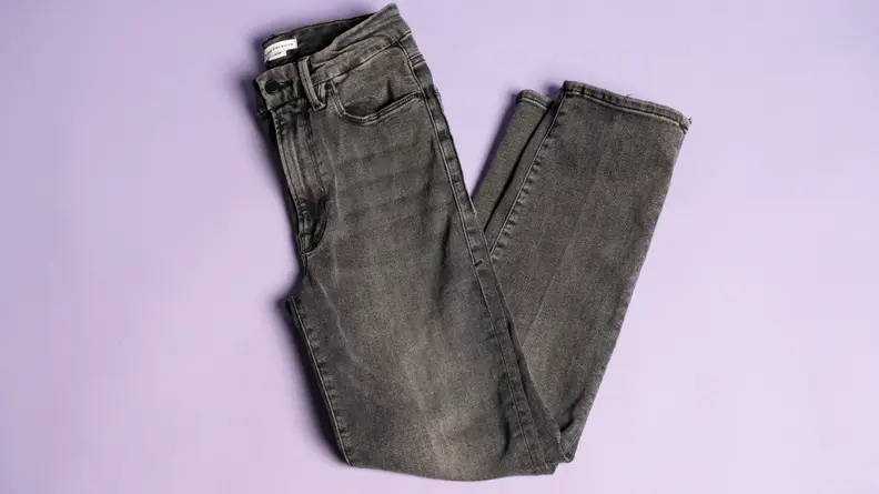 Grey jeans on a lavender background