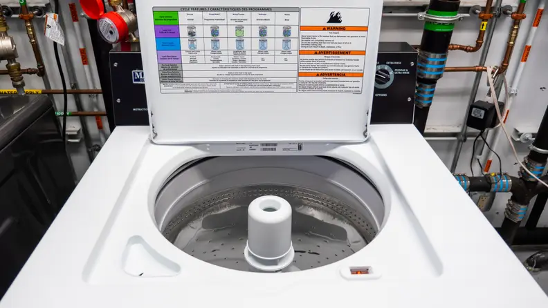 A shot of the Maytag MVWP576KW Top-loading Washing Machine with Pole Agitator in our labs, lid open.