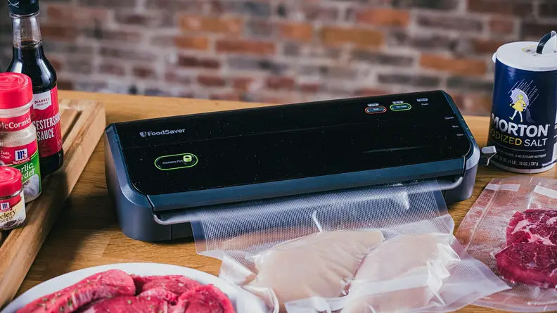 Vacuum sealer sitting on a table.