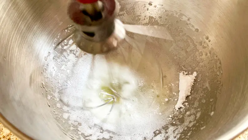 Add the confectioner's sugar when the egg whites are frothy.