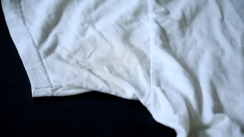 After using the baking soda paste on the pit stain on the left side of the shirt, the pit stain had noticeably faded.