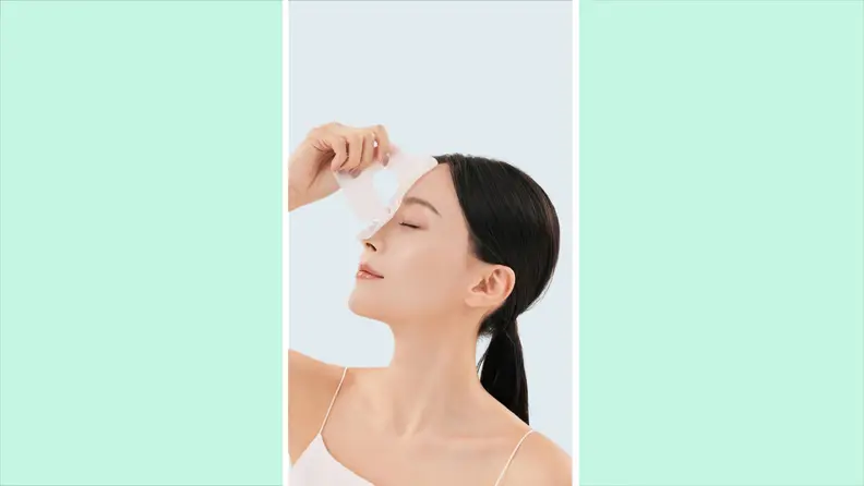 A person taking off the mask.