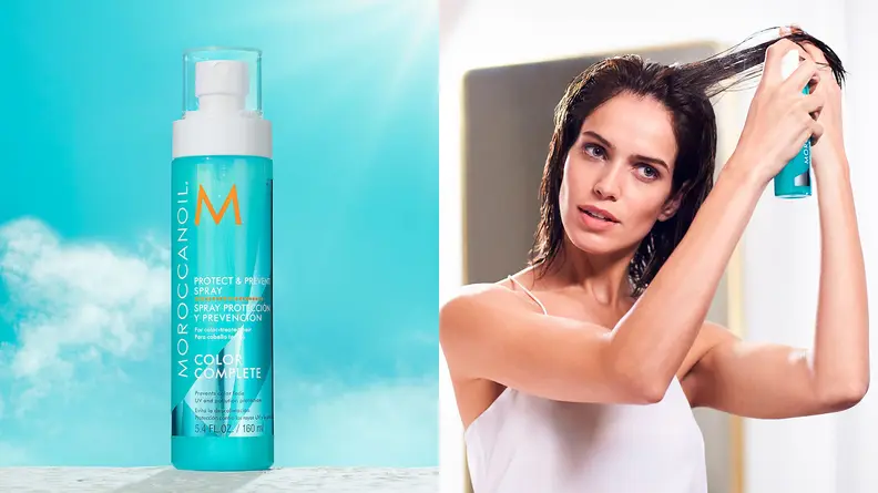 On the left: The light blue spray bottle from Moroccanoil with a blue sky behind it. On the right: A person holds a strand of their long brown hair up and sprays the blue bottle into it.
