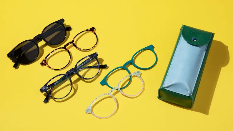 Eyeglasses and case on yellow background