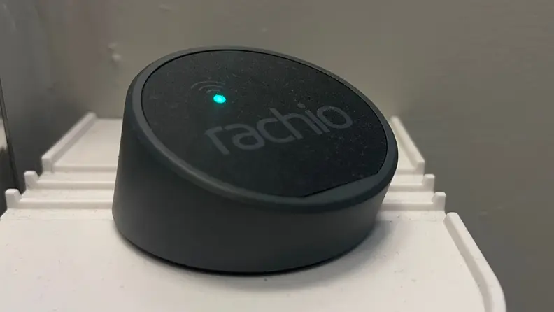 The Rachio Wi-Fi hub sitting on a white shelf