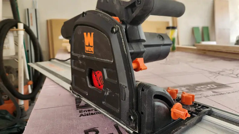 Close-up view of the Wen Track Saw on workbench inside of garage.