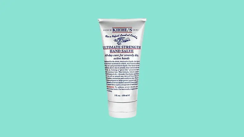 Tube of hand cream against teal background