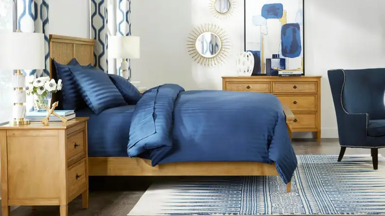 Blue satin sheets on a bed