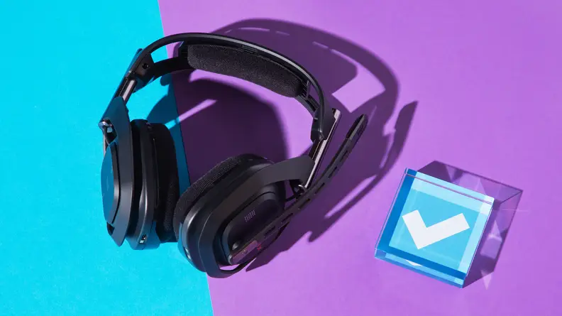 A pair of Logitech Astro A50 X gaming headphones against a split purple and blue backdrop