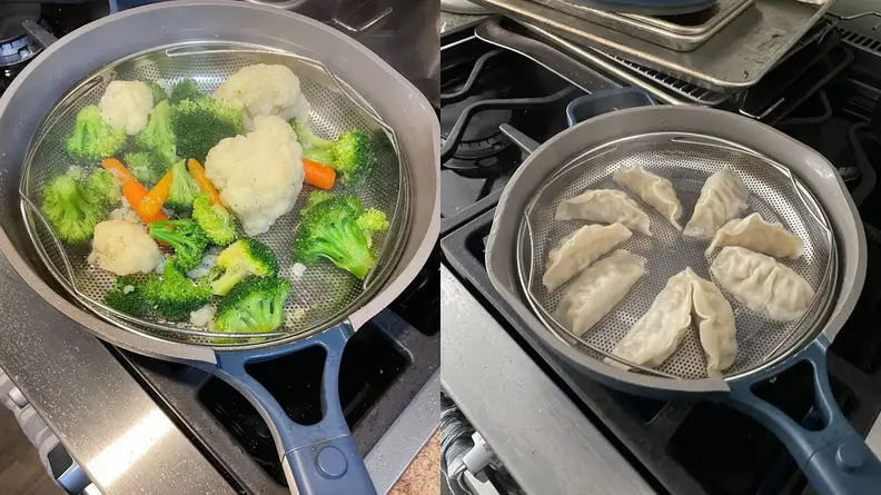 Steamed vegetables and dumplings cooking inside of skillet pan.