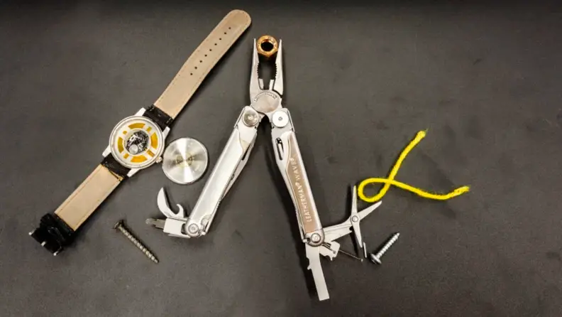A multitool against a gray background.
