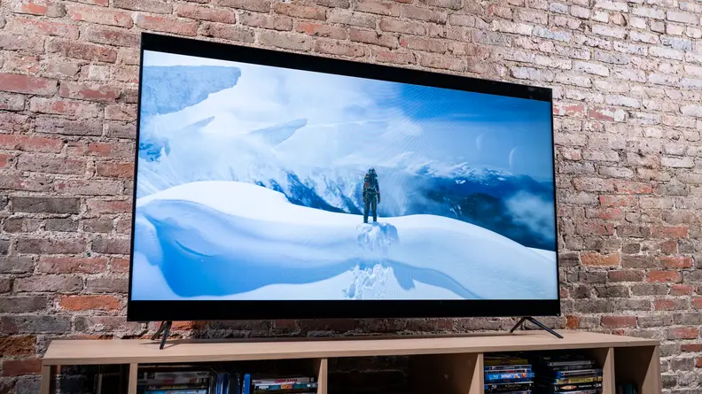 On a Vizio TV screen, a fictional astronaut climbs a snowy mountain on an alien world.