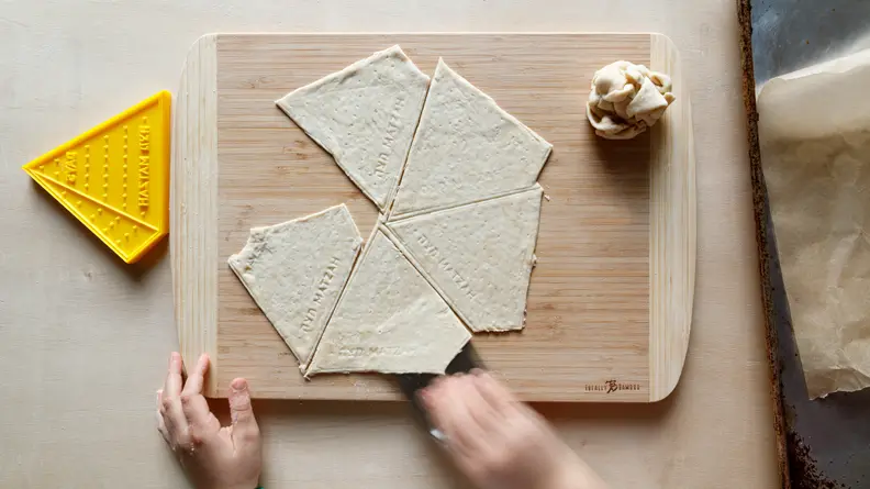 Child making matza