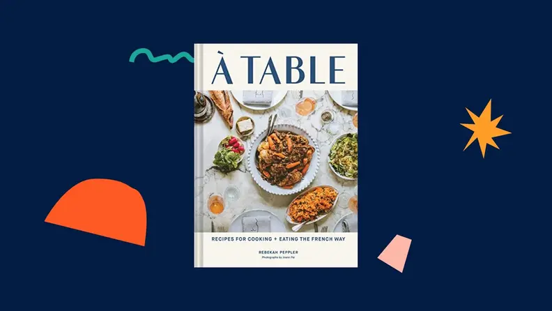 À Table cookbook against a dark blue background.