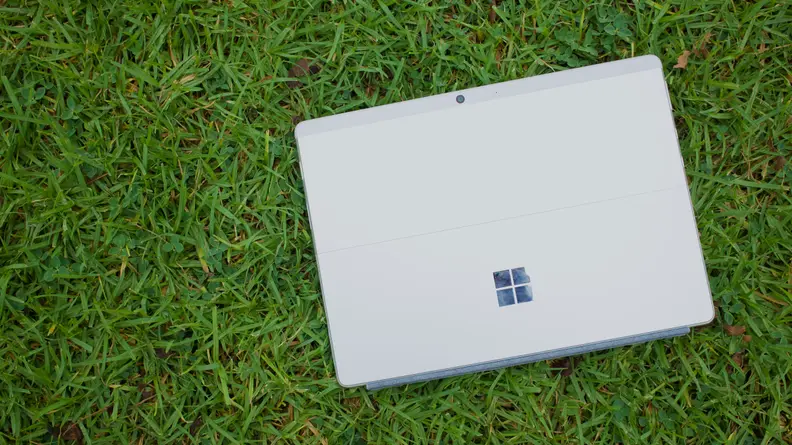 An overhead view of the back of the Surface Pro X, showing its kickstand and rear camera.