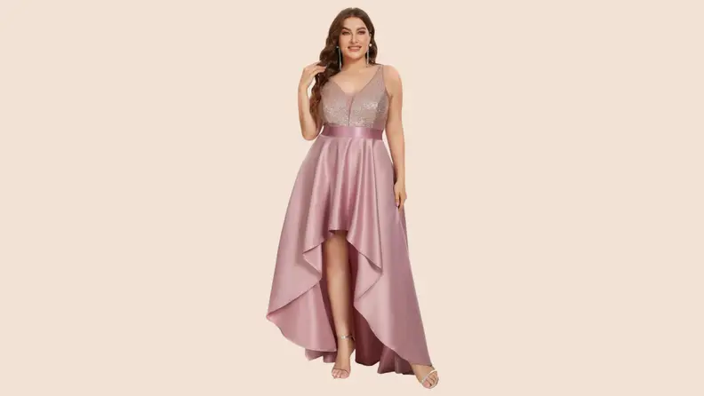 A model wearing a satin pink high-low style gown.
